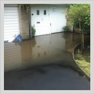 flood-damaged driveway